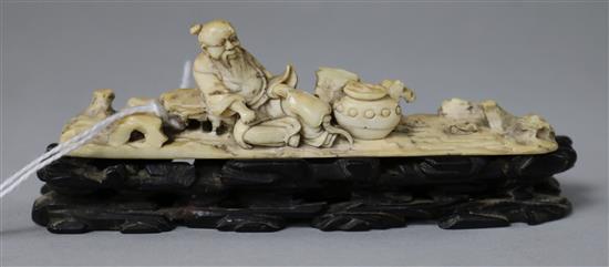 An 18th/19th century Chinese ivory figure of a sage, wood stand 9.5cm